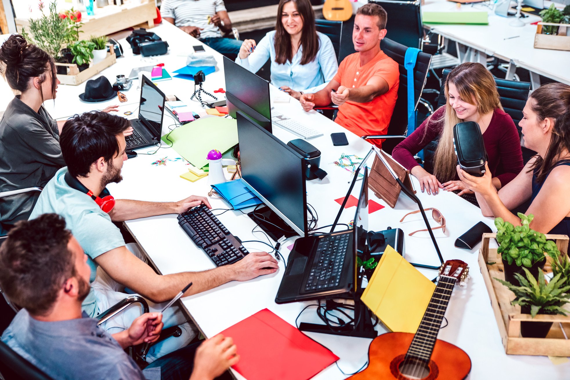 Office Workspace with Young Employees Collaborating